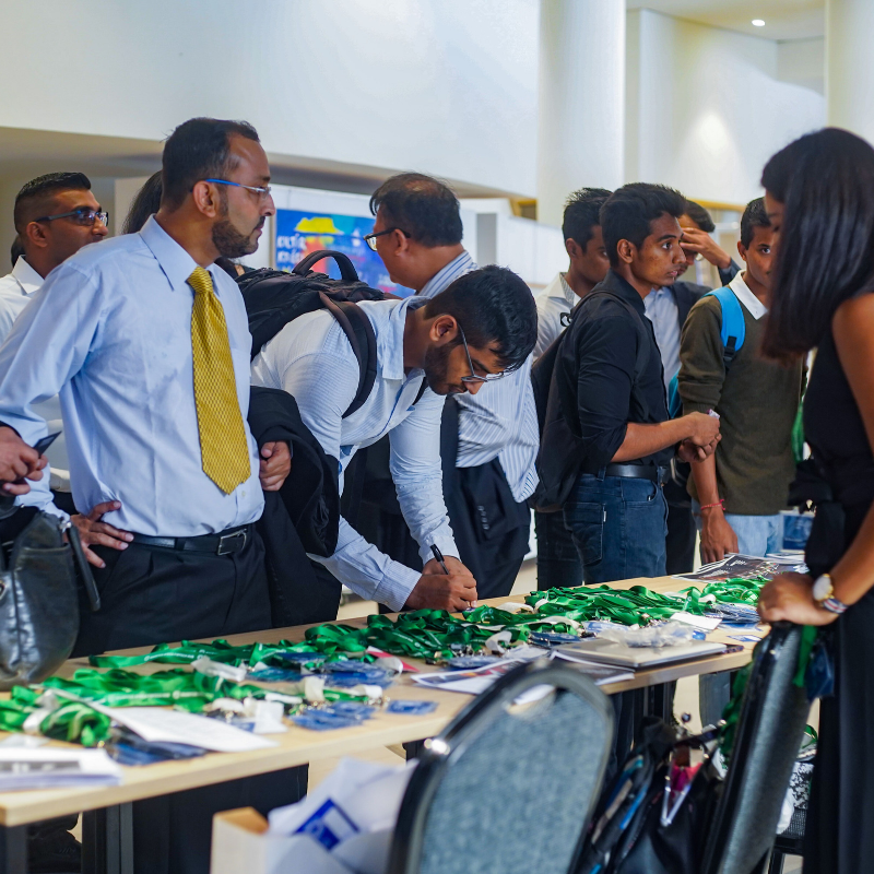 Attendees getting name tags - April Event